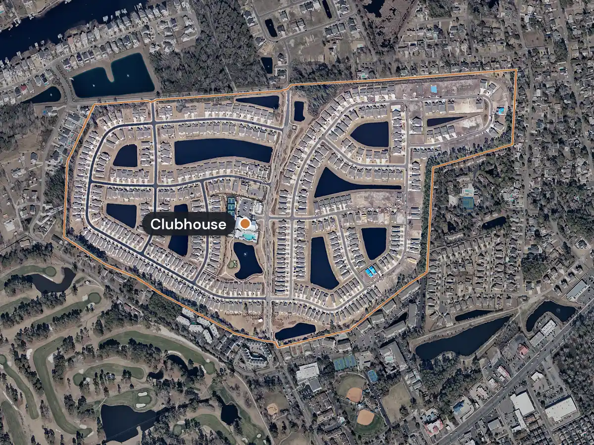 Del Webb North Myrtle Beach from above in winter, with its edge drawn in orange: curving streets of homes around ponds, and the clubhouse with its pools and courts marked in the middle
