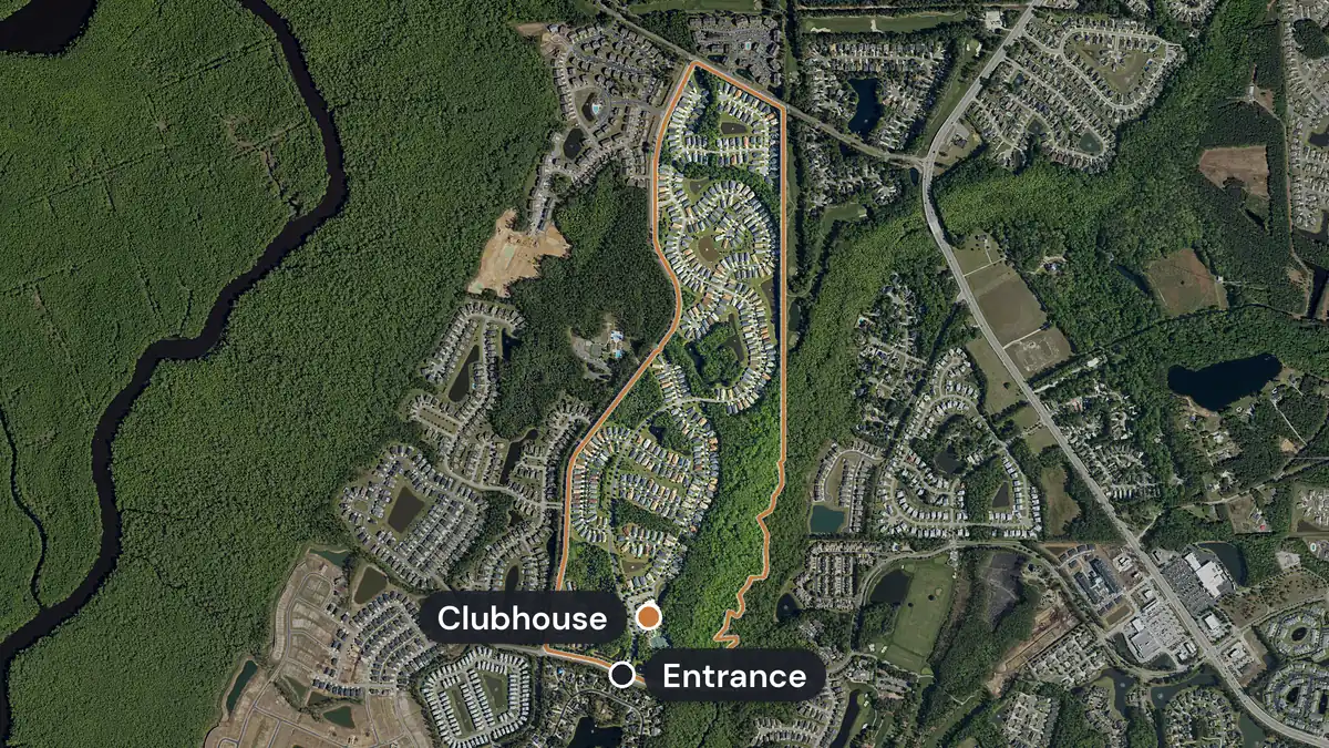Seasons at Prince Creek West from above, with its long, narrow edge drawn in orange, curving streets of homes around ponds, woods on the east side, and the clubhouse and entrance marked