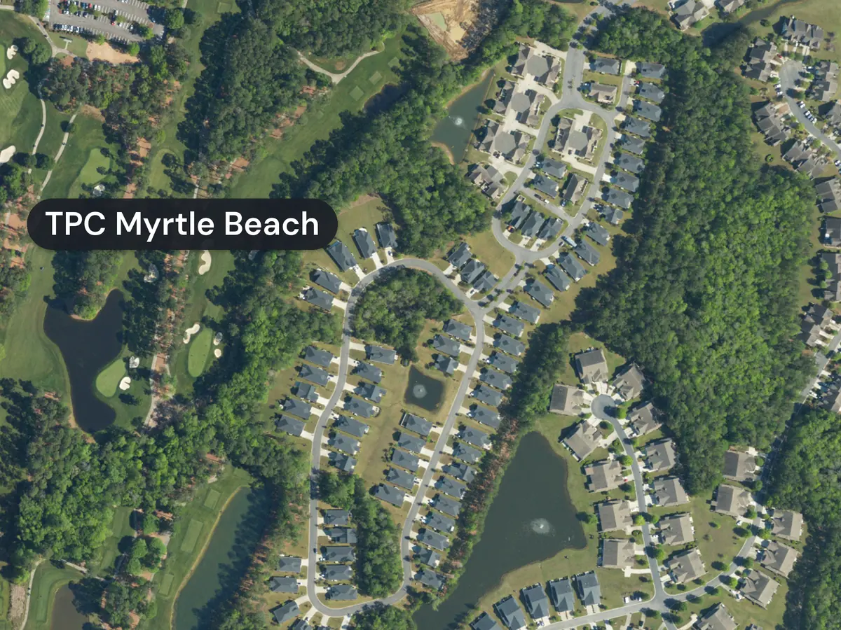 Prince Creek from above: curving streets of houses and ponds beside green golf fairways and greens, labelled TPC Myrtle Beach